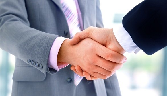 handshake isolated on blue background