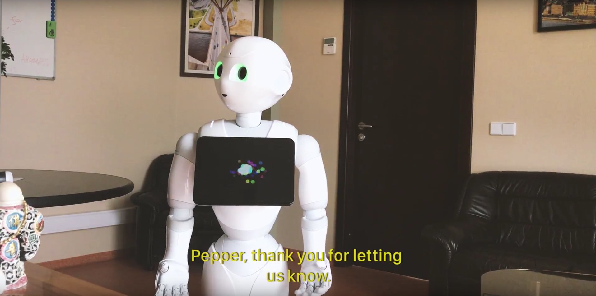 Scene from vlog: Robot Pepper came to the executive to announce the developer’s work